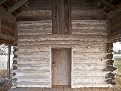 Wall with door to sleeping loft 