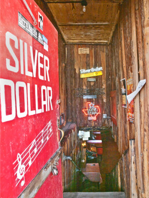 Entrance to Arkey Blue's Silver Dollar Saloon.  Opened in 1914 as Fox Hole.  Changed to the Silver Doller in 1942. Bandera, TX