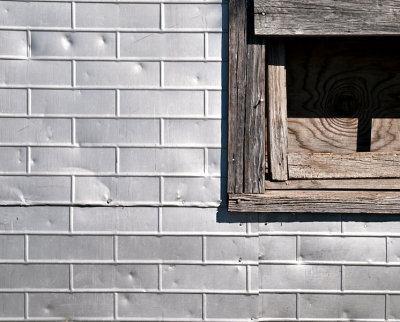 Pressed tin wall and wood window
