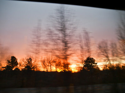 Sunset through a fast moving train window