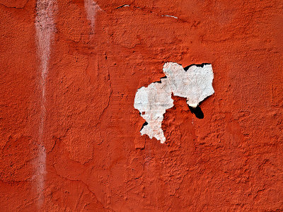 Flaking red paint