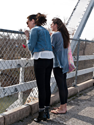 Daughter and grand daughter spitting off bridge, Bastrop, TX