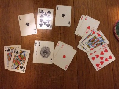All 8 Aces in Pinochle in the kitty!  118 points  