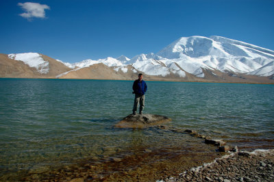 Richard with Muztagh Ata and Karakul Lake, Xinjiang, China