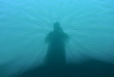 My shadow in the deep blue waters of the the Takht-e Soleyman crater