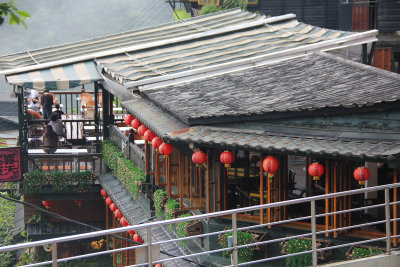 View from the tea house of a traditional Taiwanese house with lanterns.