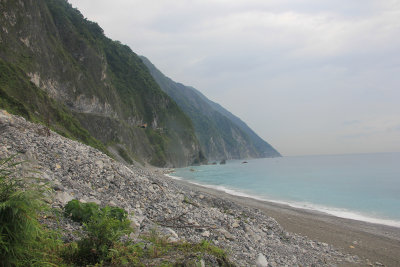 Many rocks fall from the cliffs onto the beach.