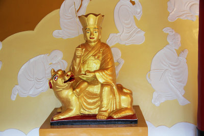 A golden figure with a dog.