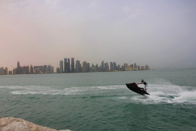 A jet skier passing by along the Corniche.