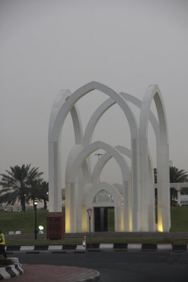 Sculpture at al Bida Park, in the center of a roundabout. The pointed arches are found in traditional architecture of Qatar.