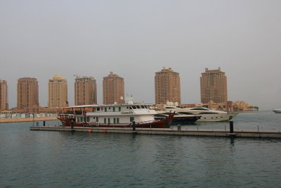 Luxury boats on the Pearl waterfront.