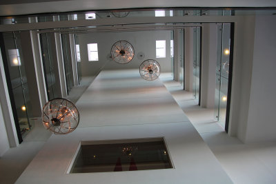 Chandeliers hanging from the atrium of the hotel.