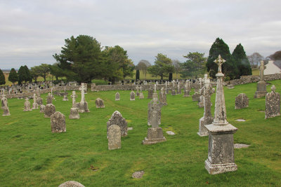 More gravestones and tall crosses at Clonmacnoise Cemetery.