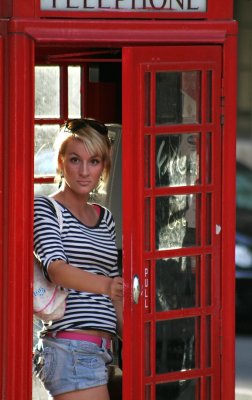 girl in red phone booth-London