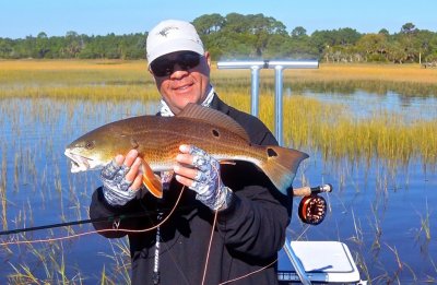 Rich with a nice colored tailing Redfish