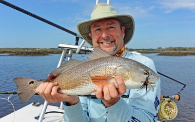 Wayne from Jax with his 1st Redfish on fly 23 long