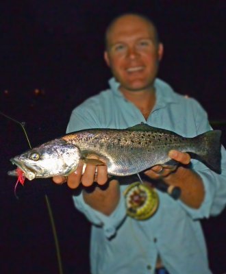 Schuyler  from Austin, Texas with his 1st Sea Trout went 5 lbs. off the dock lights