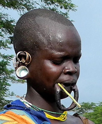 Surma woman with streched lower lip for a lip plate;  south-western Ethiopia.