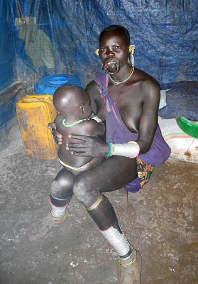 Surma woman with baby; south-western Ethiopia.