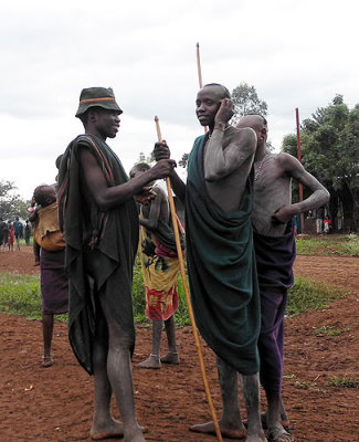 Surma men with white body paint;  south-western Ethiopia.