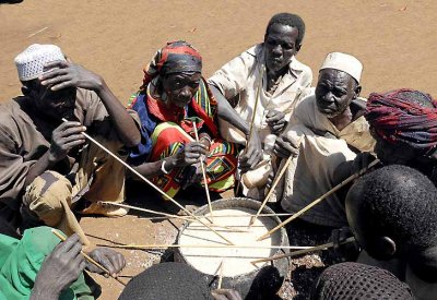 Komo tribals sharing a communal meal. Ethiopia.