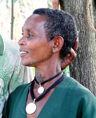 Amharic woman in Yebab near Bahirdar with tattoos on her face and neck. Ethiopia.