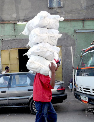 Transport of sacks in a street of Addis Ababa. Ethiopia.