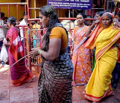 Devotees that have made vows circle round the temple and prostrate every few metres,Yellamma temple,Saundatti,Karnataka, India.