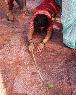 Devotees that have made vows circle round the temple and prostrate every few metres,Yellamma temple,Saundatti,Karnataka, India.