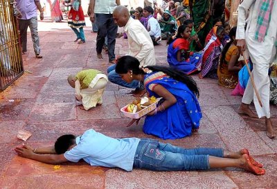 Devotees that have made vows circle round the temple and prostrate every few metres,Yellamma temple,Saundatti,Karnataka, India.