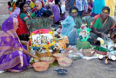 Devotees with brass bust of goddess Yellamma, Yellamma temple, Saundatti, Karnataka, India