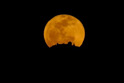 The Full Worm Moon rising behind Lick Observatory