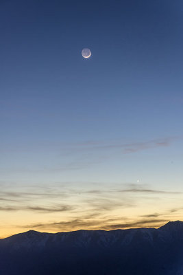 Earthshine Moon and Venus setting over the Panamint Mountains