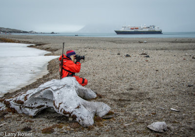 Naturalist With Explorer In Background