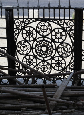 steel pipes and ornate gate