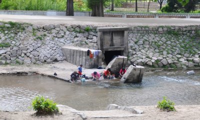 washing clothes in the river