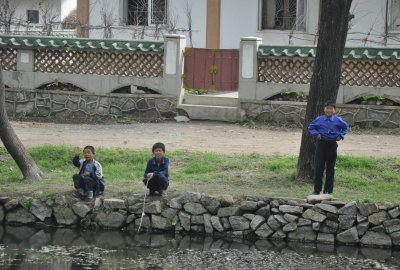 kids fishing if you look closely you can see one of them is a latchkey kid