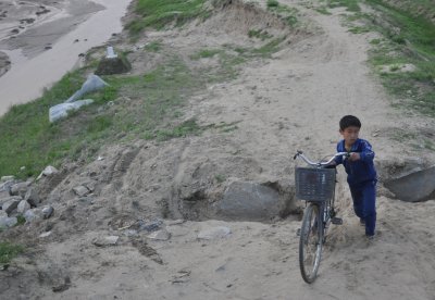 bashful child and bicycle