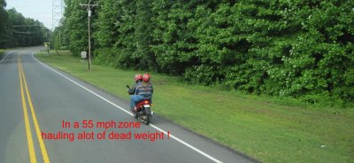Of course riding two up will slow down a mopeds speed
