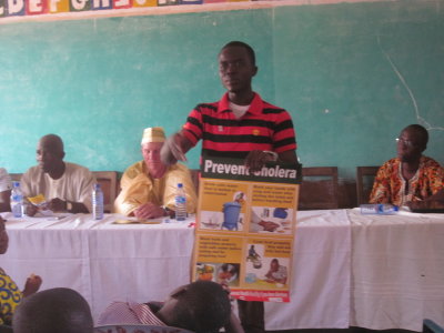 Rudolph lecturing about health and handwashing at awards ceremony.