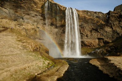 Seljalandsfoss Waterfall With Rainbow