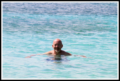 Randy Floating in the Blue Water