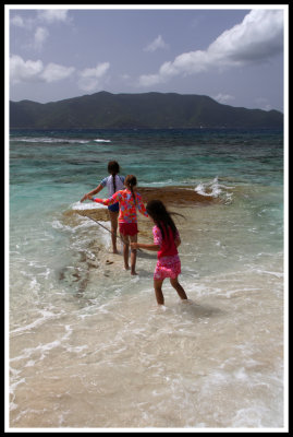 Three Mermaids Playing on the Rocks