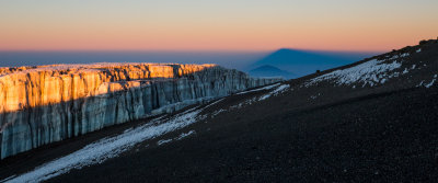 Kilimanjaro's shadow being cast over Mt Meru.
