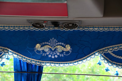 Ornate curtains on the bus