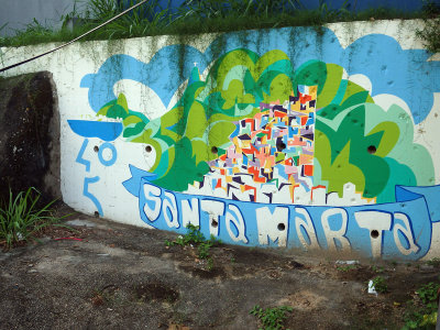 Santa Marta sign at the top of the favela