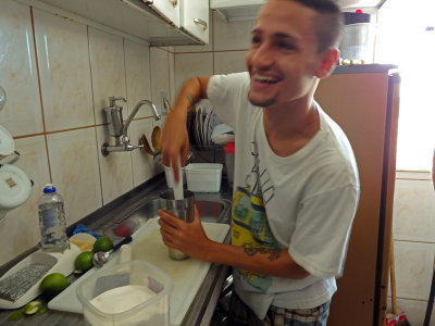 Our guide making us a local rum drink in his boss's home