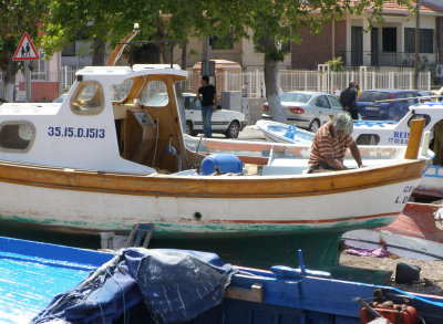 A fisherman working on his boat