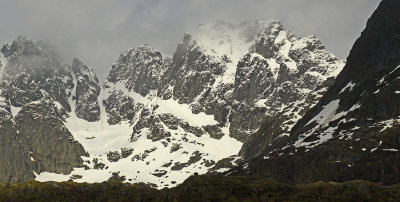 SNOWY MOUNTAINS AND FOG