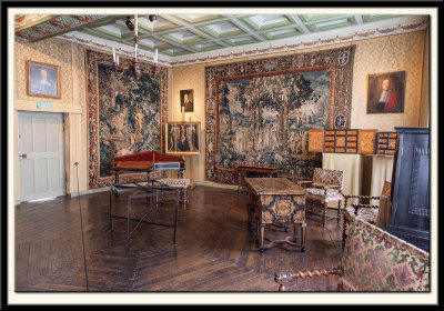 A room with octagonal flooring and a fine ceiling.